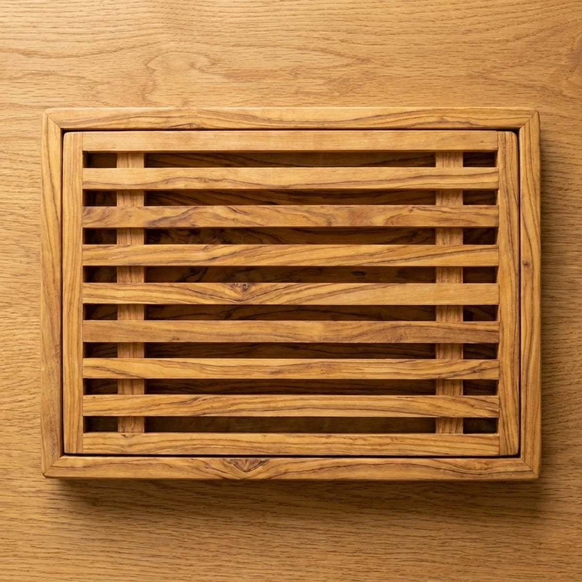 The Alba Olive Wood Bread Board with Crumb Tray seen from above, the full grain readable