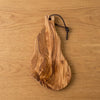 The Alba Olive Wood Board with Leather Loop seen from above, the full grain readable