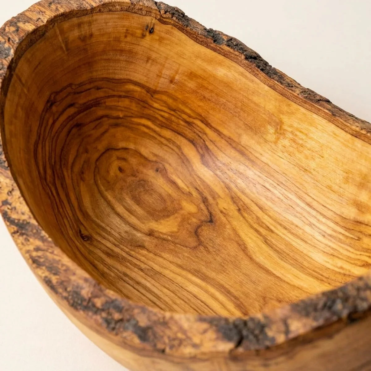 Macro of the polished interior grain of the olive wood bowl