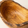 Macro of the polished interior grain of the olive wood bowl