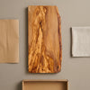 The Alba Live-Edge Olive Wood Slab with its kraft wrapping and plain shipping box