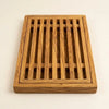 The Alba Olive Wood Bread Board with Crumb Tray alone on a plain background