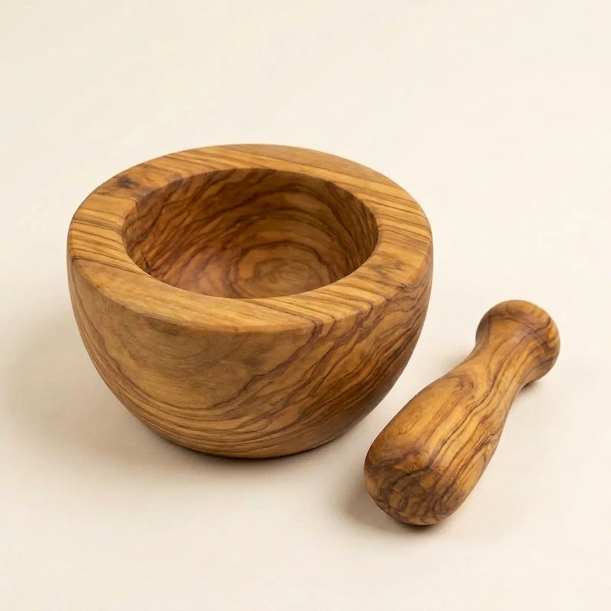 The Alba Olive Wood Mortar and Pestle alone on a plain background
